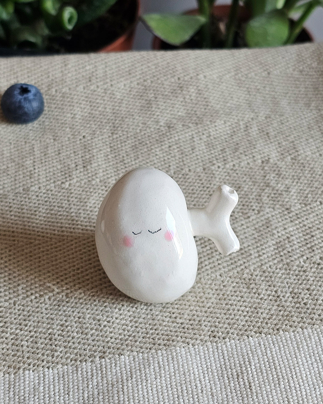 Rene in ceramica bianca a forma di fagiolo, scultura fatta a mano